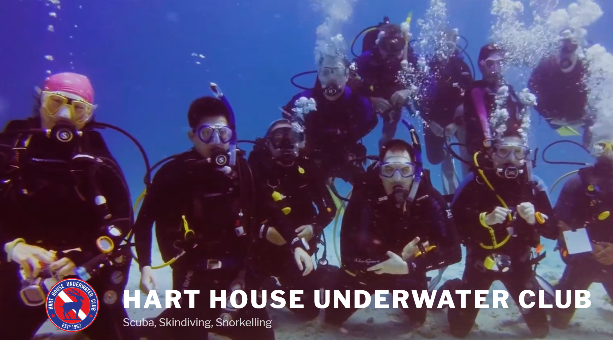 HHUC with name, logo, divers posing underwater