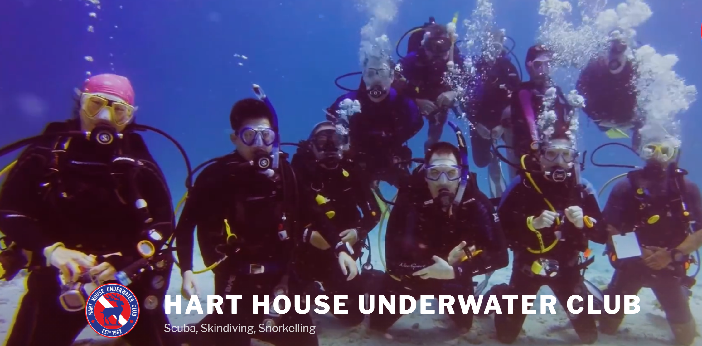 HHUC with name, logo, divers posing underwater