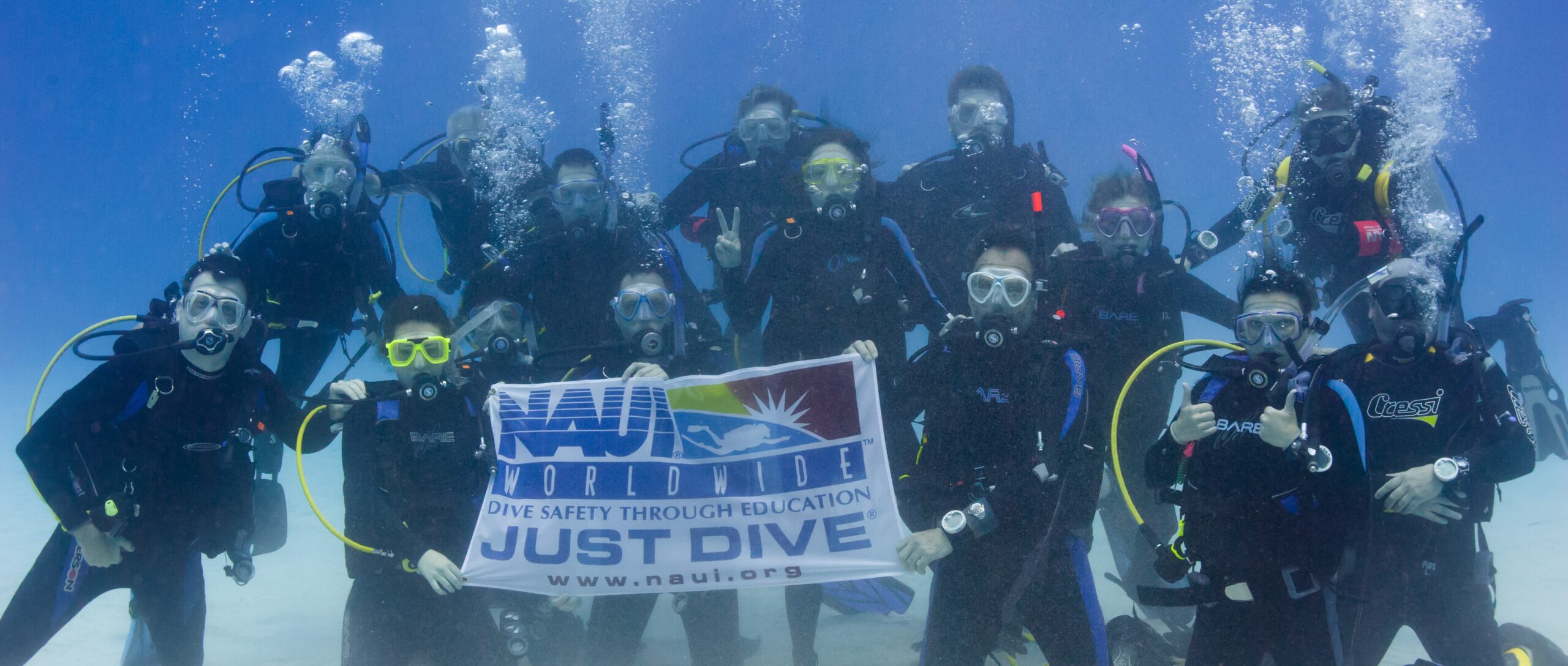 HHUC-group-photo-underwater-with-naui-banner.